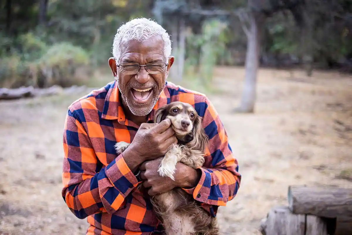 A happy man with his puppy A happy man with his puppy