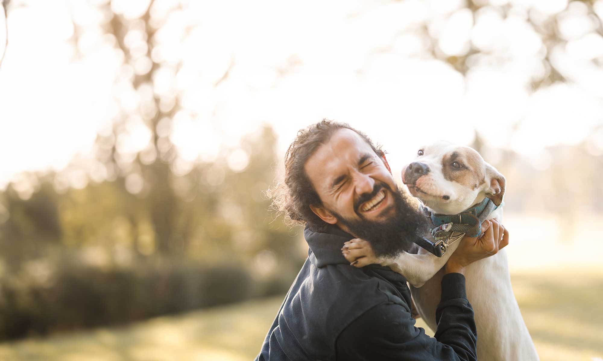 Man hugging puppy