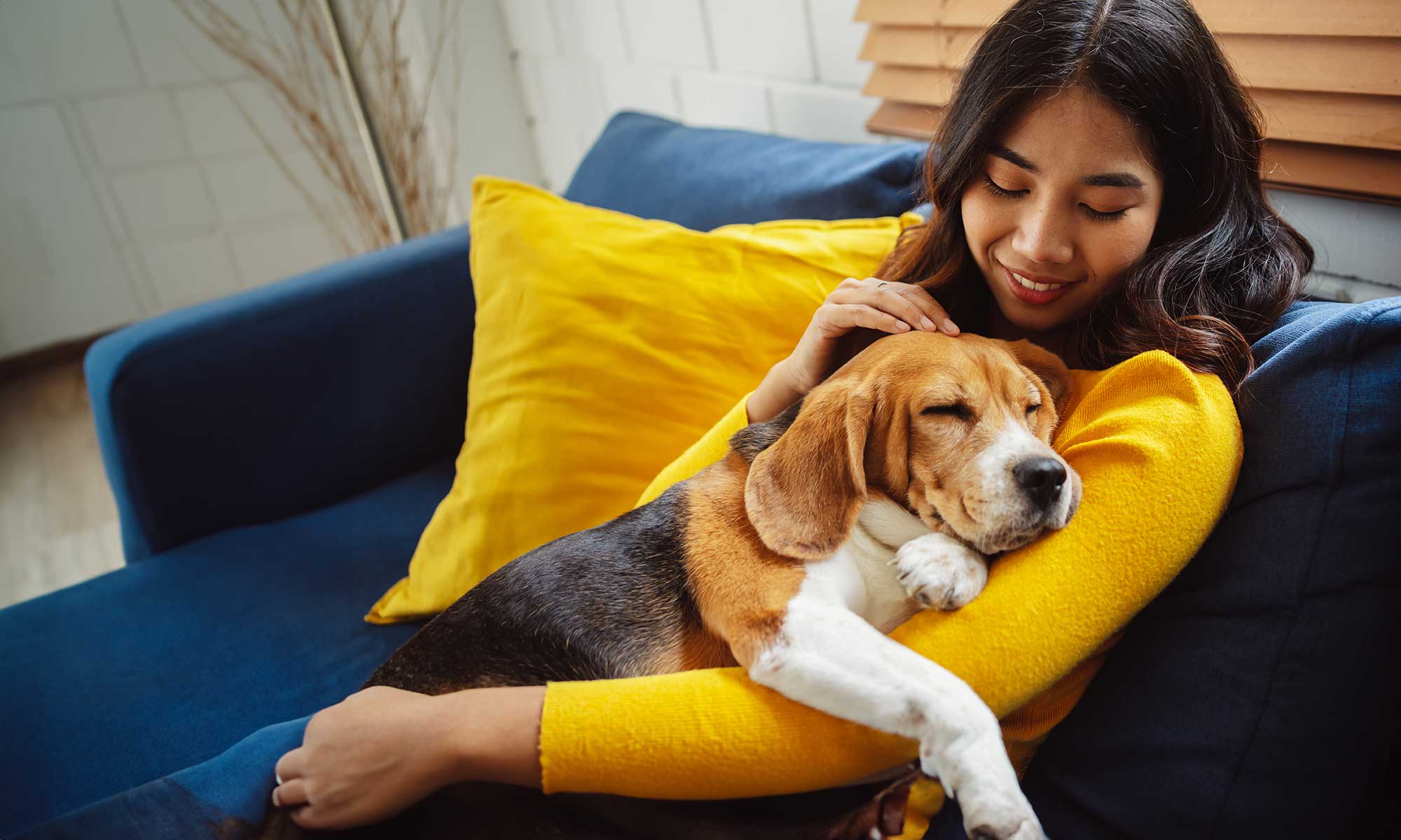 A woman hugging her dog